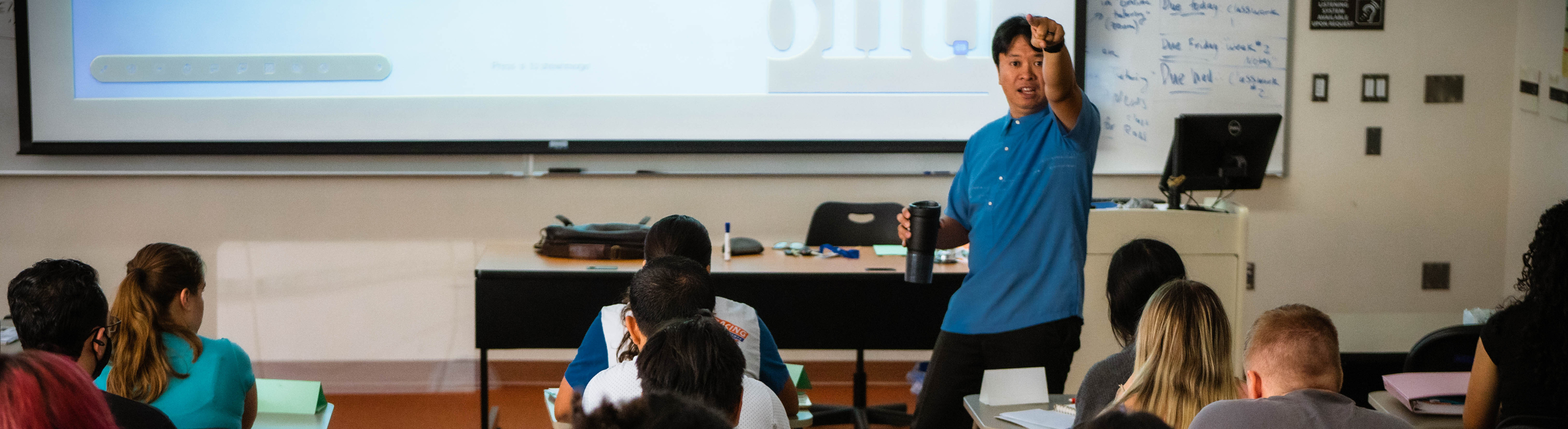 Professor Cirian Villavicencio teaching to students in classroom
