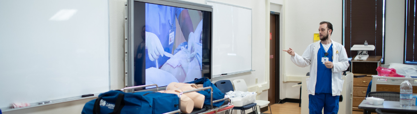 Nursing professor teaching to students in classroom